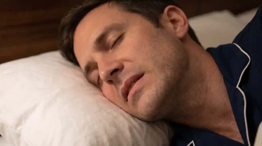 Adult experiencing teeth grinding or bruxism during sleep